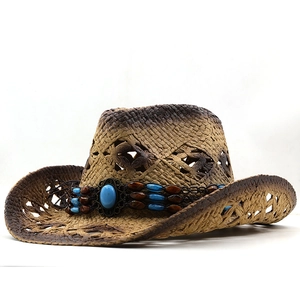 Distressed vintage straw cowboy hat with turquoise bead band for sun protection