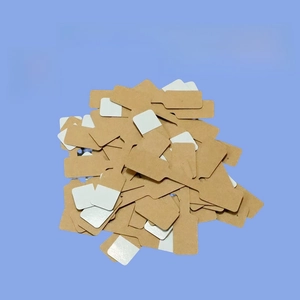 Macro shot of self-adhesive kraft paper jewelry tags with long attachment stems