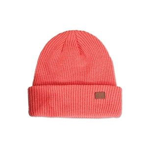 Detailed close-up of coral pink ribbed knit beanie with a stylish brown leather patch