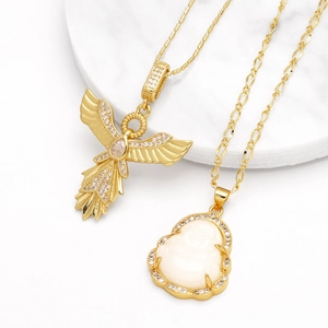 Gold eagle phoenix and Buddha pendant necklace set with zircon stones on white marble