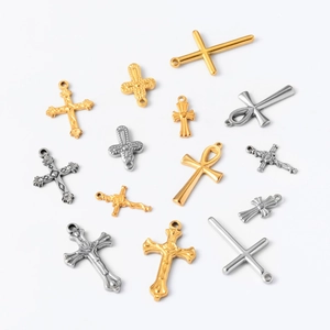 Detailed collection of vintage stainless steel cross pendants in gold and silver finishes