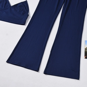 Navy blue two-piece set featuring a cropped camisole and wide-leg trousers laid flat