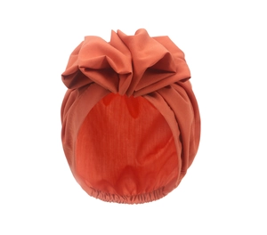Detail of burnt orange turban hat featuring a large 3D bow and elastic pleats