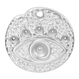 Macro view of silver evil eye pendant charm in stainless steel with embossed dot patterns