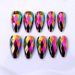 Detail of holographic metallic almond press-on nails with 3D embossed diamond texture