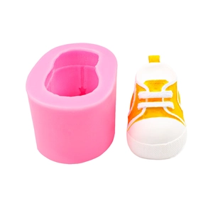Pink silicone sneaker mold and yellow canvas shoe sculpture for DIY soap and candle making