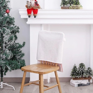 White plush Christmas chair cover with Merry Christmas embroidery and festive scene