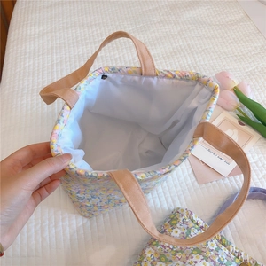 Detailed interior view of the floral cotton lunch bag with reinforced webbing handles