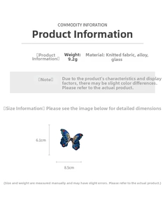 Detail view of butterfly jewelry dimensions 6.1cm by 8.5cm with blue knit and gold frame