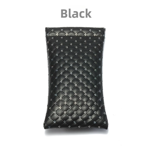 Detail of black quilted PU leather glasses pouch with silver metal rivet studs