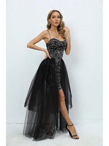 Detail of sequined bodice and detachable sheer mesh skirt on a black party dress
