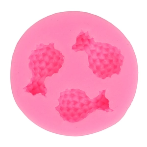 Pink silicone mold featuring three pineapple cavities for fondant and cake decoration