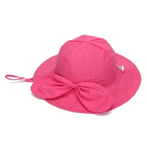 Detail of rose red sun hat featuring a large bow and adjustable white chin strap cord