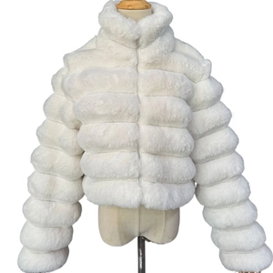 Close-up of white faux fur jacket showing high-quality fluffy texture and stripe stitching