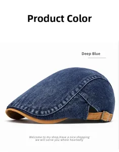 Detail of blue denim beret showing adjustable brown strap and metal buckle closure