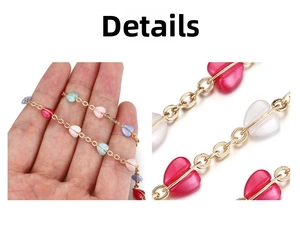 Macro shot of colorful heart-shaped beads on a delicate gold-plated copper chain