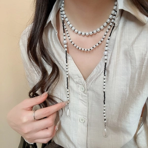 Double-layer pearl and black bead necklace with long tassels and drop pendants