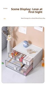 Detail of drawer organizer with white rabbit handles for stationery and cosmetics