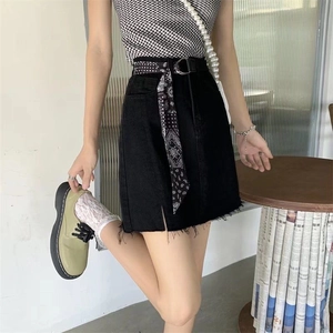 Fashionable denim skirt with raw hem and black paisley scarf belt with metallic D-ring buckle