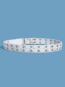 Detail of white punk belt with silver star studs and sequins on blue background