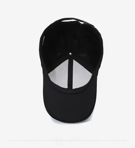 Detailed view of black baseball cap interior with reinforced white lining and stitches