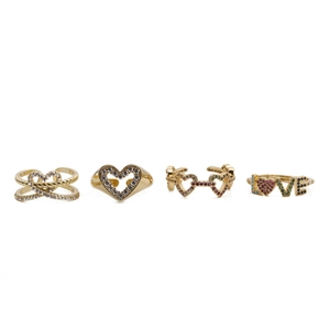 Detailed view of four golden heart-themed rings featuring LOVE letters and zircon inlay