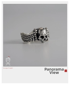 Front view of vintage punk ring showing detailed skull and wings with silver finish