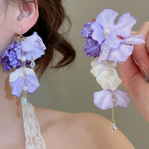 Detail of purple chiffon flower tassel earrings with pearls and crystal beads on model