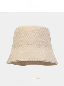 Detail showing the 3D bubble texture and foldable design of the beige sun bucket hat