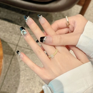 Handmade black French press-on nails with luxury rhinestones and matching rings