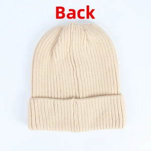 Back view of beige core-spun yarn knit beanie showing vertical ribbed texture
