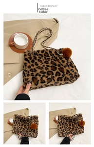 Detail of leopard print plush tote bag featuring woven chain strap and furry pompom charm