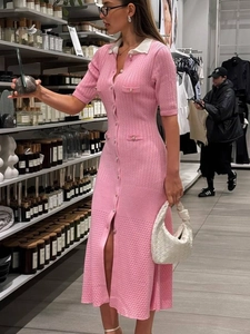 Short sleeve pink knit dress with white contrast lapel and pearl buttons in a slim midi fit