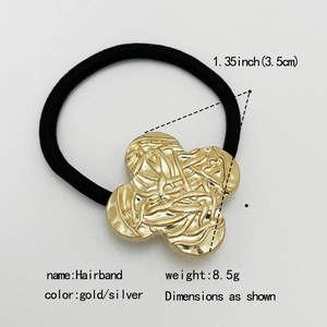 Macro shot of gold four-leaf clover hair tie with woven texture and 3.5cm dimension info