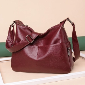 Classic wine red crossbody bag in soft washed leather with adjustable shoulder strap