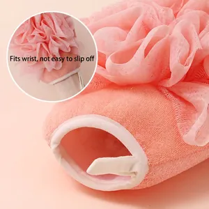 Pink double-sided bath glove with mesh sponge and snug elastic wrist for exfoliating
