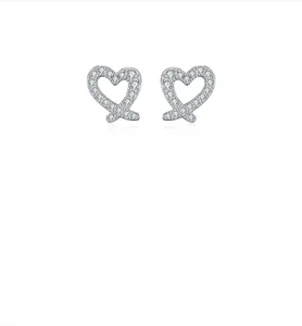 Detail shot of heart-shaped S925 sterling silver earrings with sparkling pavé zircons
