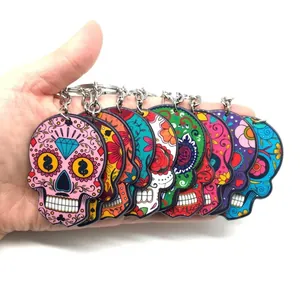 Colorful acrylic skull keychains with floral patterns for Day of the Dead celebration