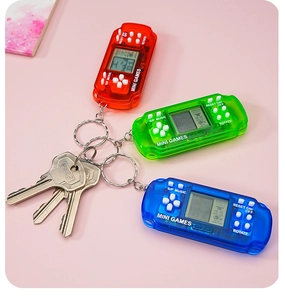 Mini tetris handheld game console keychains in red, green and blue translucent cases