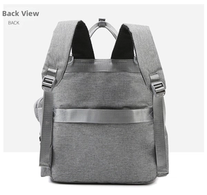 Back view of gray diaper bag showing padded straps and luggage trolley sleeve feature