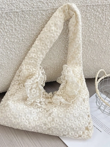 Elegant off-white lace tote bag with daisy embroidery and ruffled edges for women