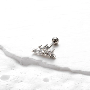 Macro shot of silver stainless steel helix stud with crown-shaped marquise zircon stones