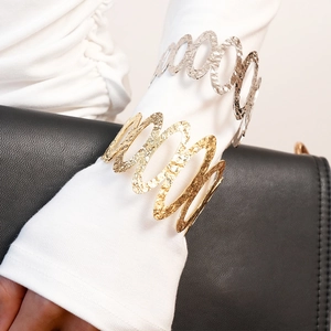 Metallic hollow wavy cuff bracelet in gold and silver finish for women fashion