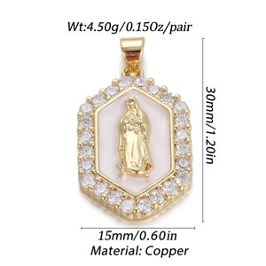 Macro detail of gold Virgin Mary pendant with cubic zirconia and white enamel