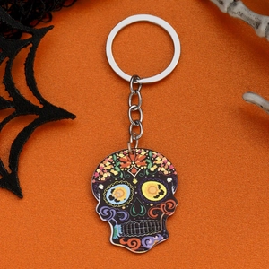 Detailed view of colorful skull acrylic keychain with spider web Halloween background