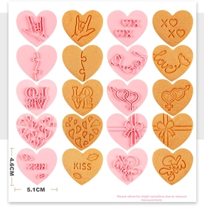 Detailed size view of pink heart cookie cutters with various love and kiss embossed patterns