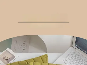Detailed view of yellow quilted cotton laptop sleeve with rhombus texture on desk