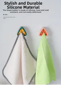 Close-up of wall-mounted silicone towel plug holder with punch-free adhesive backing