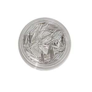 Silver ultra-fine metal strips nail art decorations in a round clear storage container