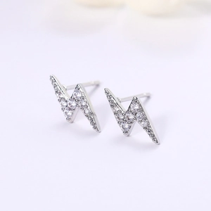 Macro view of mini lightning bolt earrings with pavé cubic zirconia in silver finish
